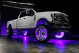 White Ford Superduty with purple LED wheel rings.