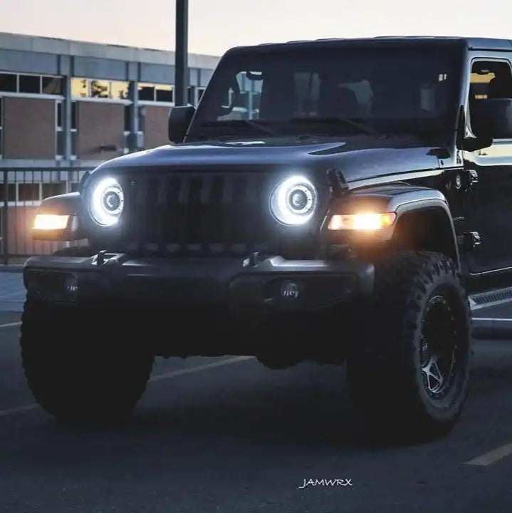 Three quarters view of a Jeep Wrangler JL with bright LED Oculus Headlights installed.