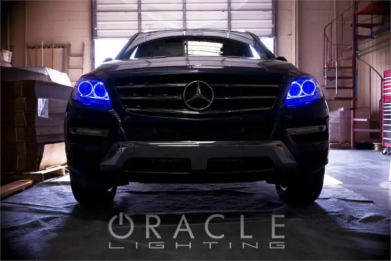 Front end of a Mercedez-Benz ML Class with blue LED headlight halo rings installed.