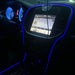 The console of a car, outlined with a blue LED fiber optic kit.