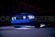 A Blue Mustang with white LED underbody kit.