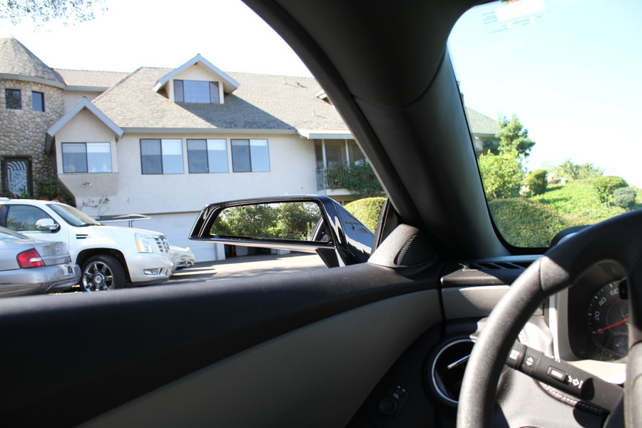 Point of view from the driver side with side mirror in view