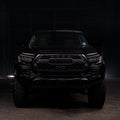 Black Toyota truck in a dark setting