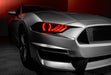 Close-up view of Ford Mustang headlight with red LEDs.