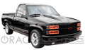 Three quarters view of a truck with red LED headlight halos.
