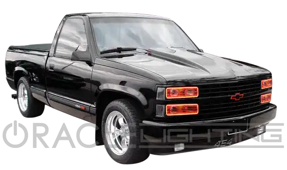 Three quarters view of a truck with red LED headlight halos.