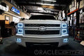 Front view of a Chevrolet Silverado with white LED headlight halo rings installed.