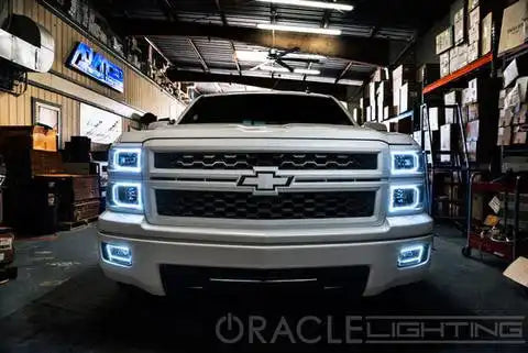 Front view of a Chevrolet Silverado with white LED headlight halo rings installed.