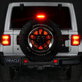 Rear end of a white Jeep with LED Illuminated Spare Tire Wheel Ring Third Brake Light installed.