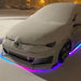 Snow covered VW with dynamic colorshift rainbow underglow.