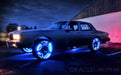 Image tracing of a silver car with blue LED wheel rings.