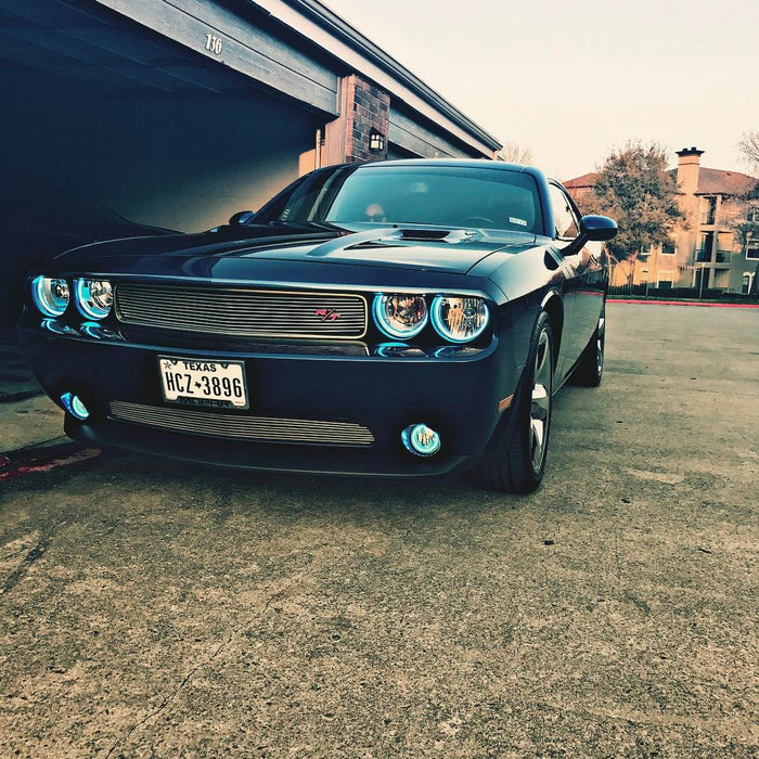 Front end of a Dodge Challenger with white LED headlight and fog light halo rings installed.