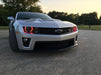 Front end of a Chevrolet Camaro with red LED headlight halo rings installed.