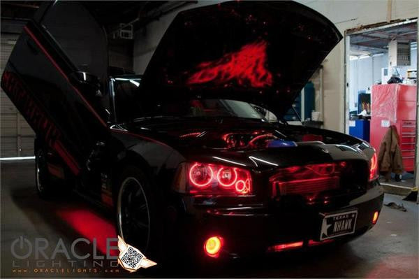 Black charger in a garage with hood and doors open and red LED lighting accents