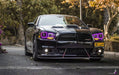 Front view of a Dodge Charger with purple LED headlight halo rings installed.