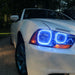 Close-up of white LED headlight halo rings installed on a Dodge Charger.