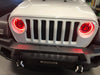 Front end of a Jeep Wrangler with ColorSHIFT Oculus Headlights installed, set to red LEDs.
