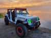 Three quarters view of a Jeep parked by the water, with ColorSHIFT Oculus Headlights installed.