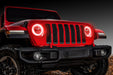 Front end of a red Jeep Wrangler JL with red headlight DRLs on.