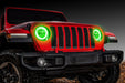Front end of a red Jeep with green headlight DRLs.