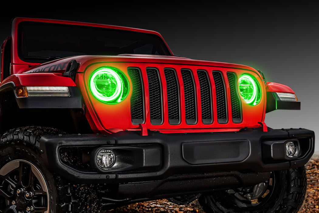 Front end of a red Jeep with green LED Surface Mount Headlight Halos.