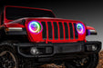 Front end of a red Jeep Wrangler JL with rainbow headlight DRLs on.