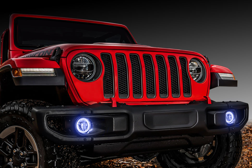 Red Jeep Gladiator with white fog light halos installed.