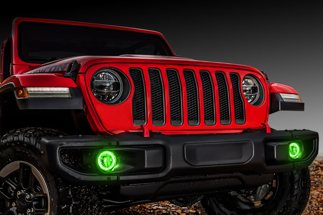 Red Jeep Gladiator with green fog light halos installed.