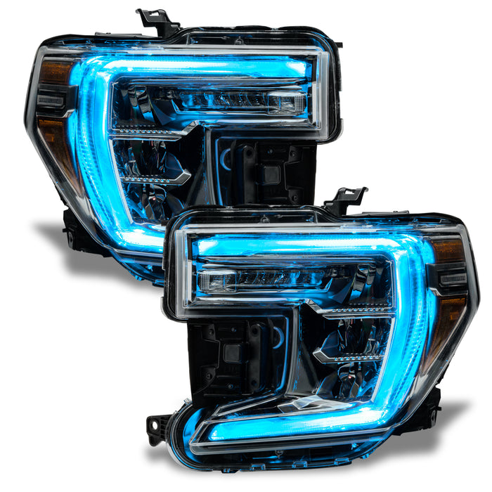 GMC Sierra headlights with cyan DRLs.