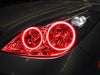 Close-up of a Lexus ES 300 headlight with red halos.