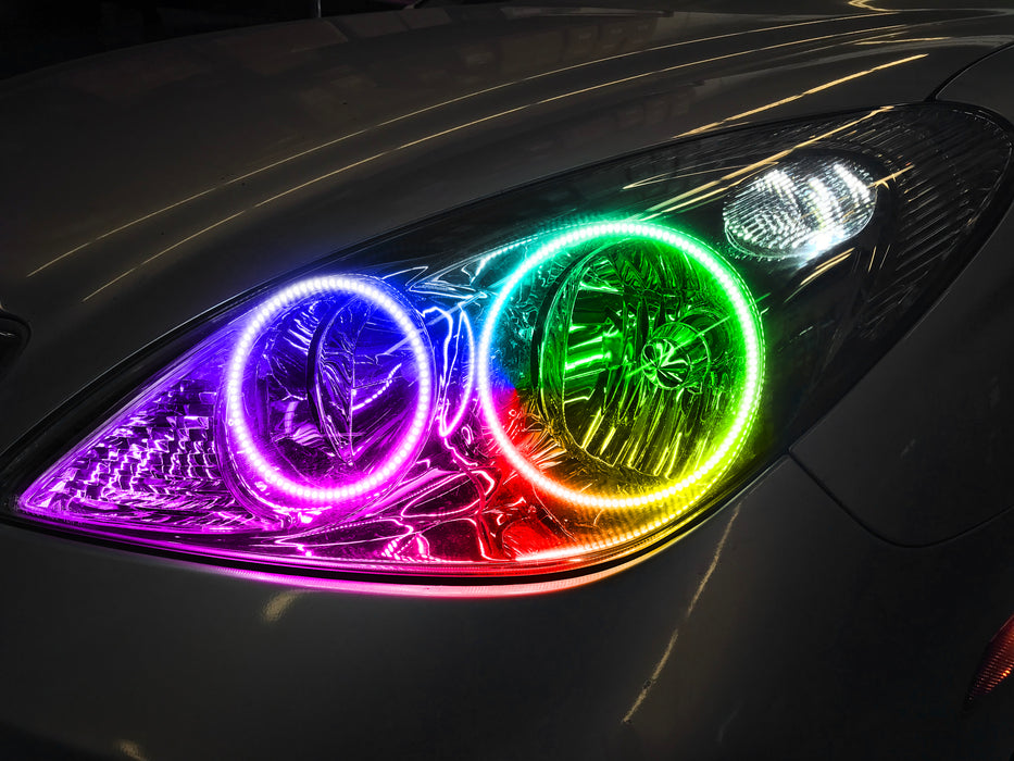 Close-up of a Lexus ES 300 headlight with rainbow halos.