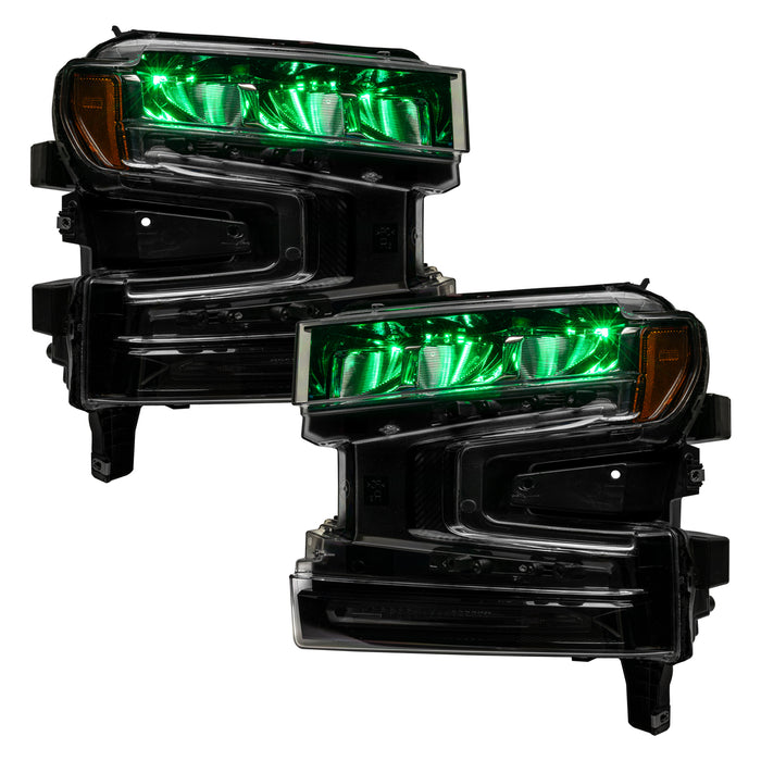 Chevrolet Silverado 1500 headlights with green demon eye projectors.