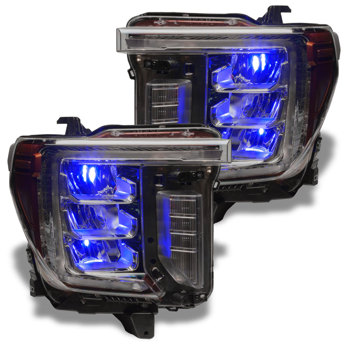 GMC Sierra headlights with blue demon eye projectors.