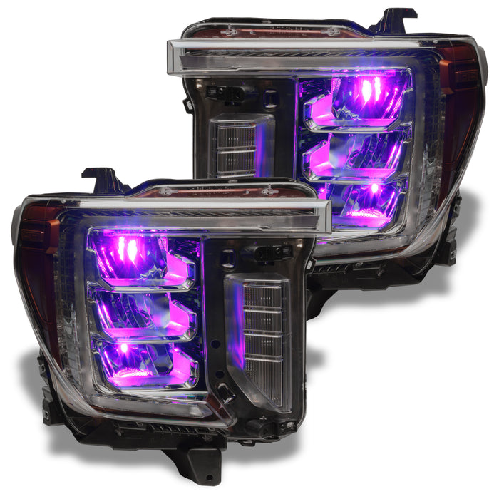 GMC Sierra headlights with purple demon eye projectors.