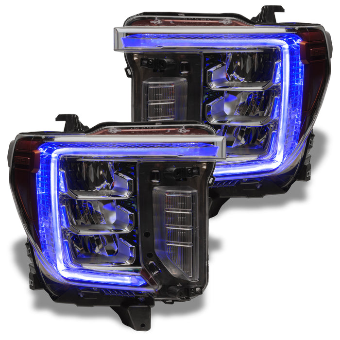 GMC Sierra headlights with blue DRLs.
