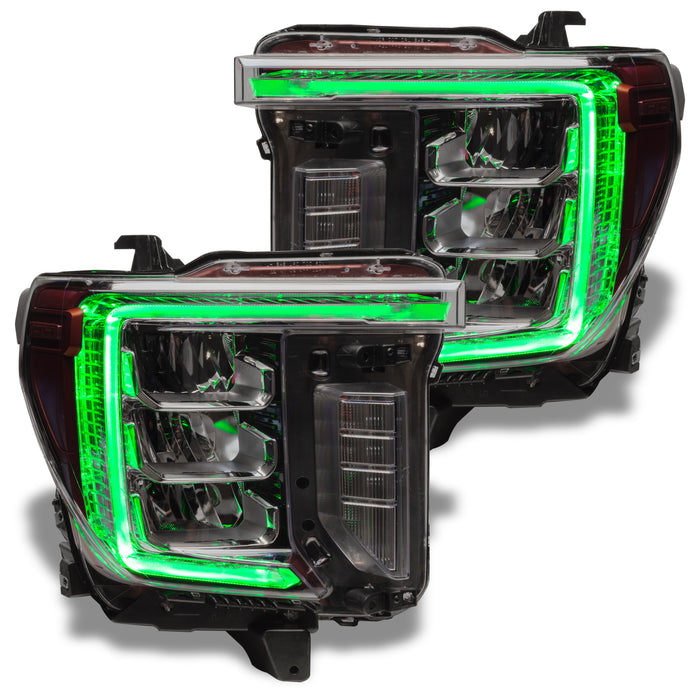 GMC Sierra headlights with green DRLs.