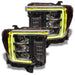 GMC Sierra headlights with yellow DRLs.