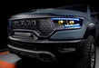 Front end of a Ram 1500 with cyan headlight DRLs and yellow demon eye projectors.