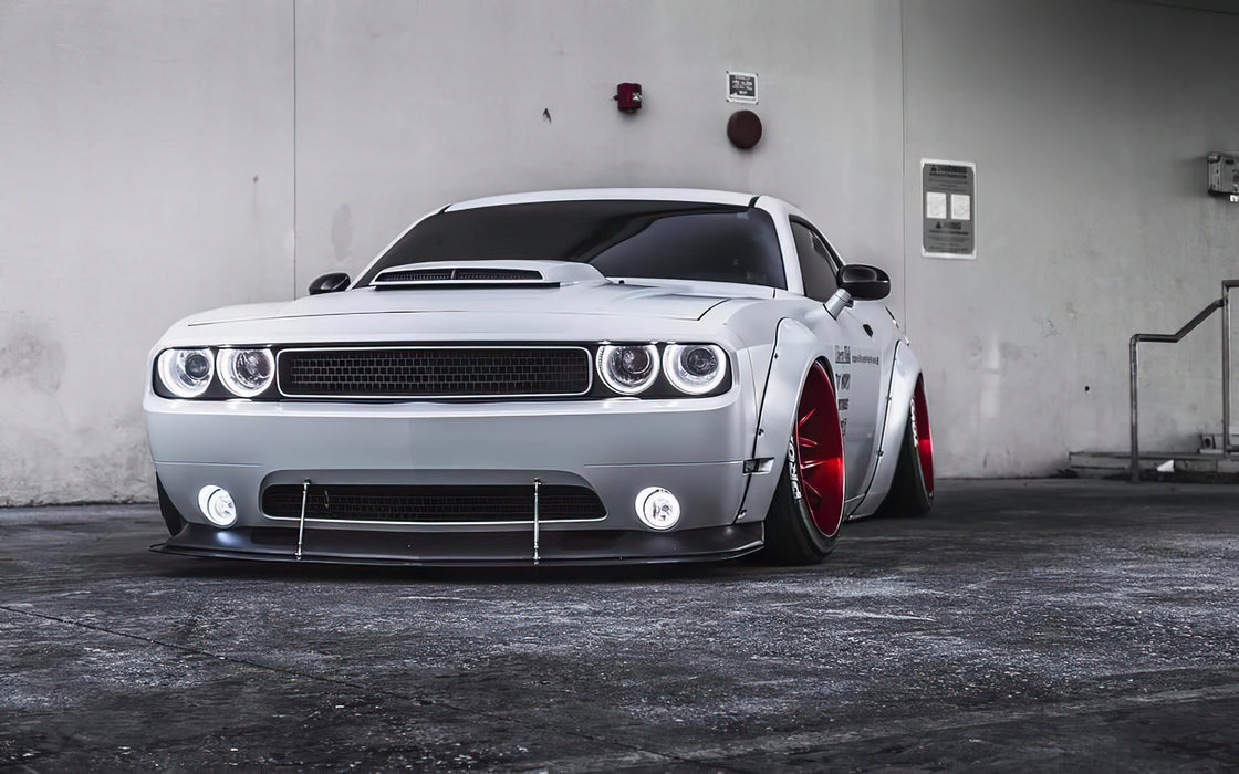 White dodge challenger with white headlight and fog light halos