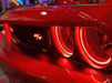 Close-up of red dodge challenger with red halo headlights