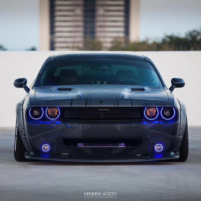 Front view of a Dodge Challenger with blue LED headlight and fog light halos