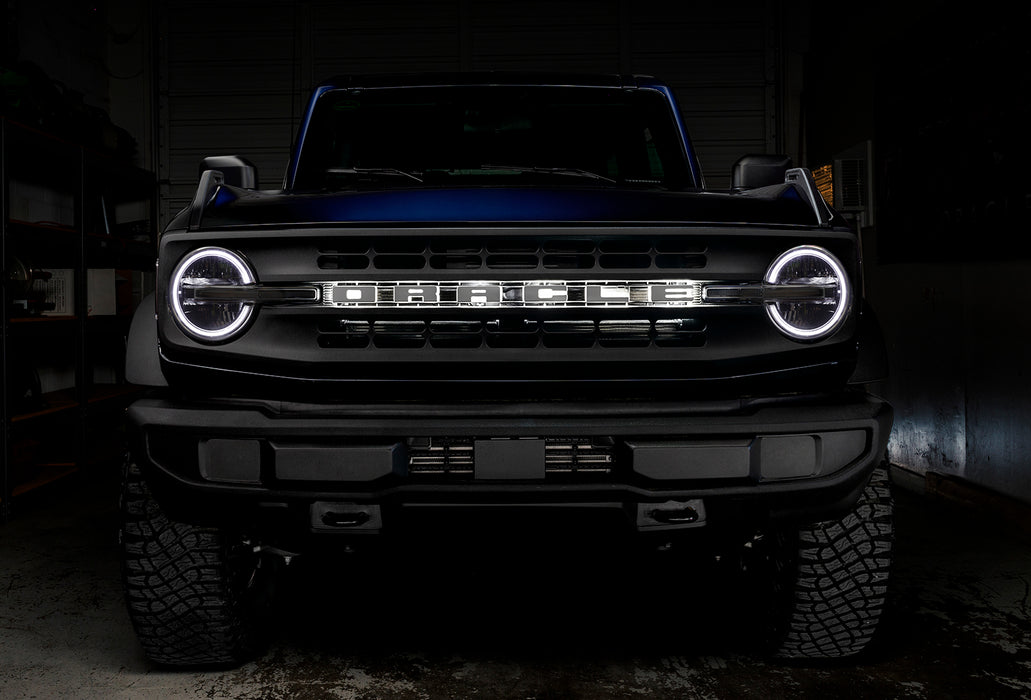 Front view of a Ford Bronco with white halo headlights.