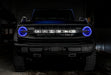 Front view of a Ford Bronco with blue halo headlights.