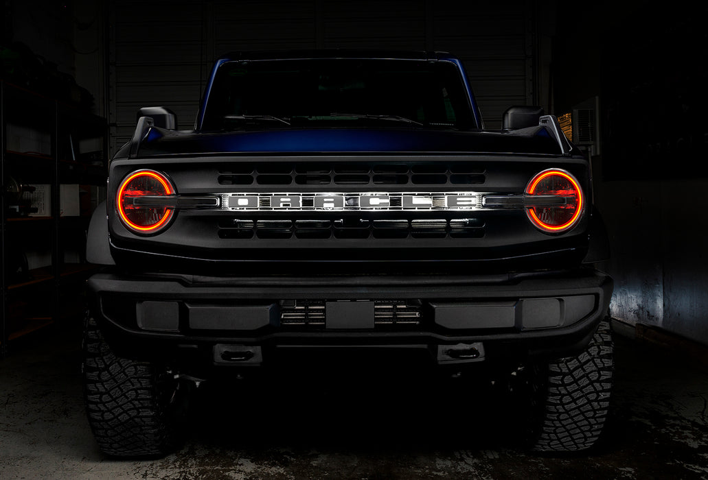 Front view of a Ford Bronco with red halo headlights.