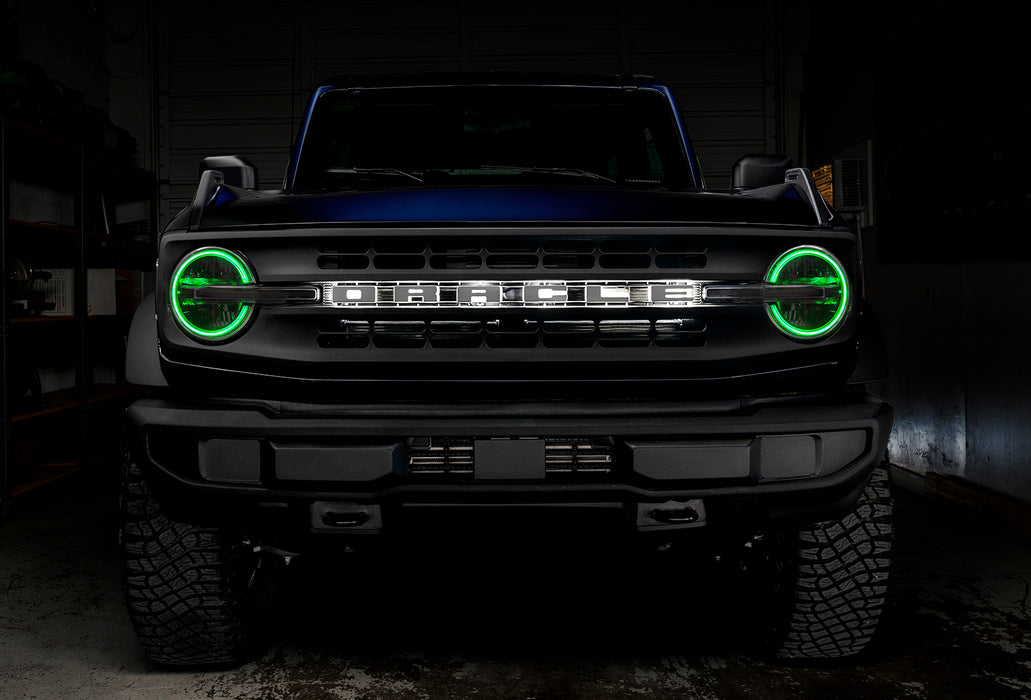Front view of a Ford Bronco with green halo headlights.