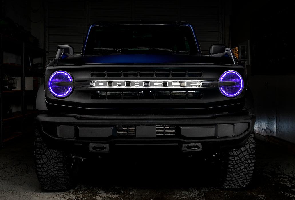 Front view of a Ford Bronco with purple halo headlights.