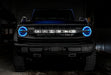 Front view of a Ford Bronco with cyan halo headlights.