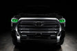  Straight front view of a black Toyota Tundra with green demon eye projectors.