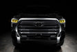  Straight front view of a black Toyota Tundra with yellow demon eye projectors.