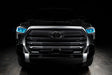  Straight front view of a black Toyota Tundra with cyan demon eye projectors.